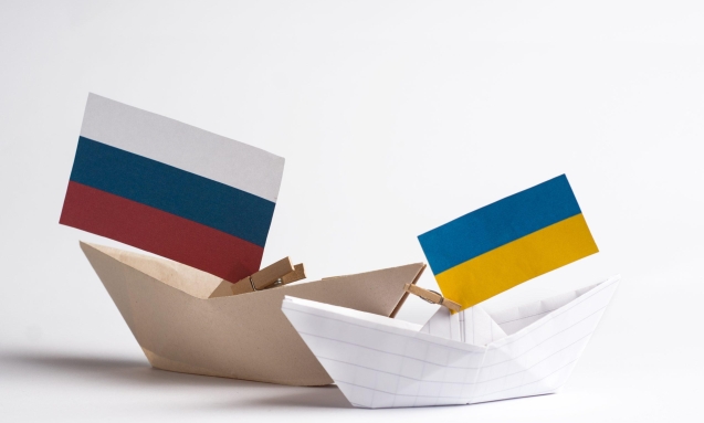 paper ships with flags of Ukraine and Russia, symbol of conflict